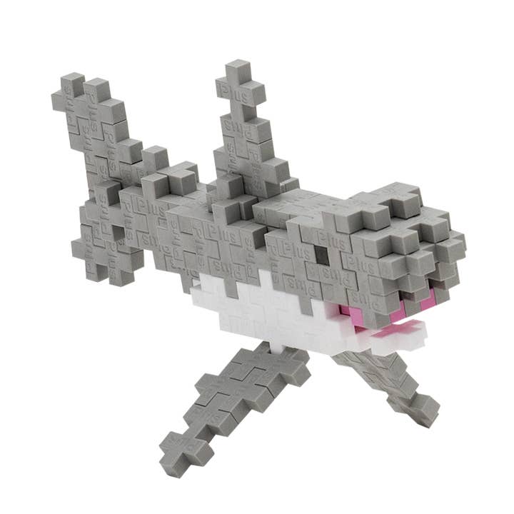 Plus Plus brand building block to create a shark supports constructive play.