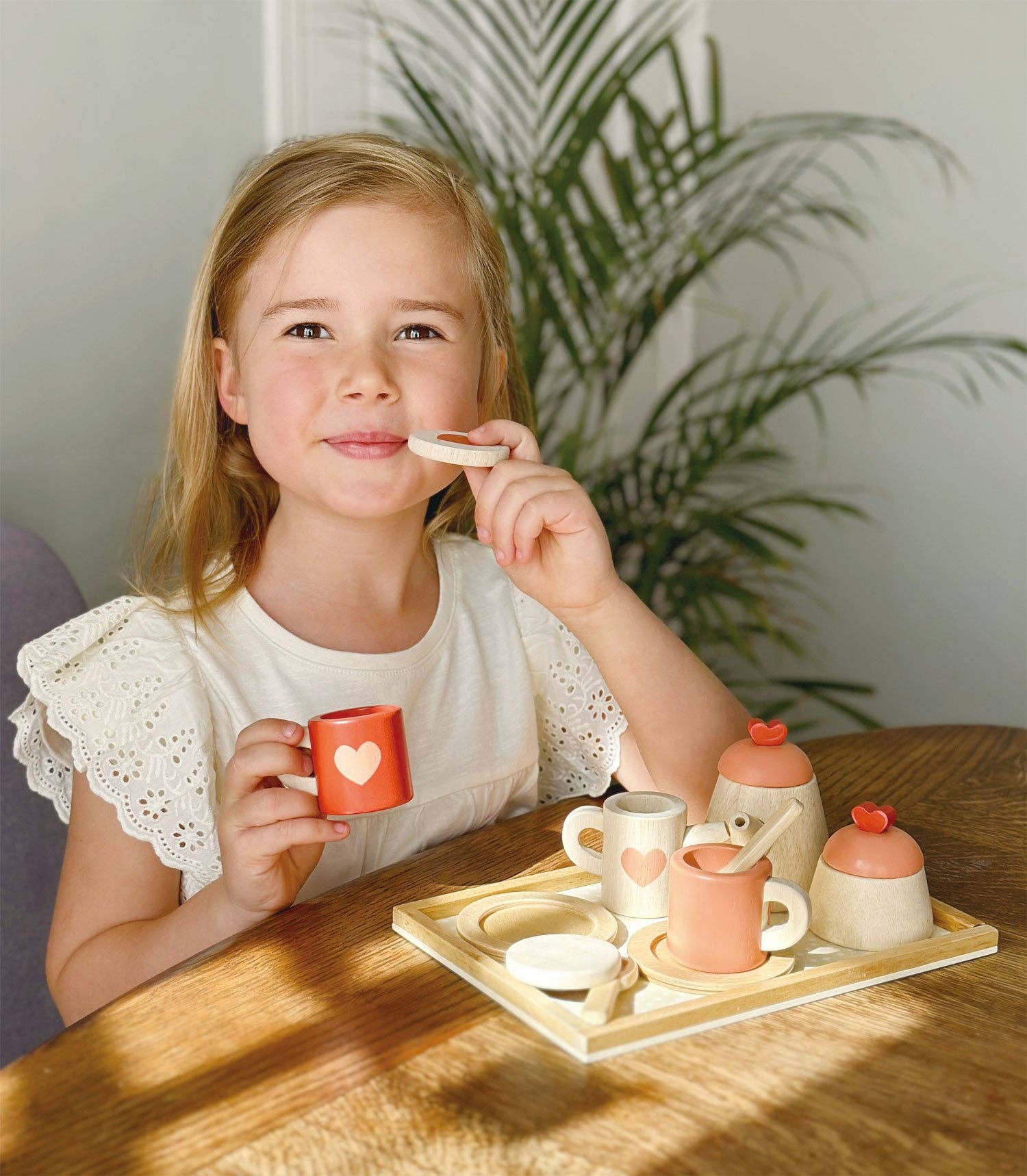 Mentari brand quality wood tea set toy with teapot, cups, saucers and cookies.