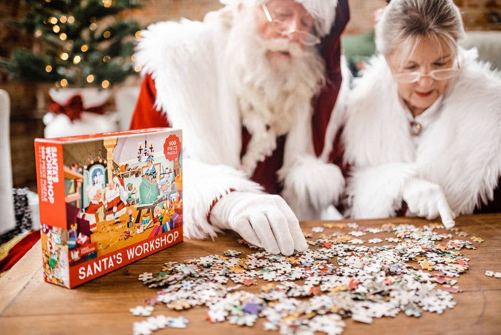 Santa and Mrs clause putting together a puzzle. Shop our holiday collection 