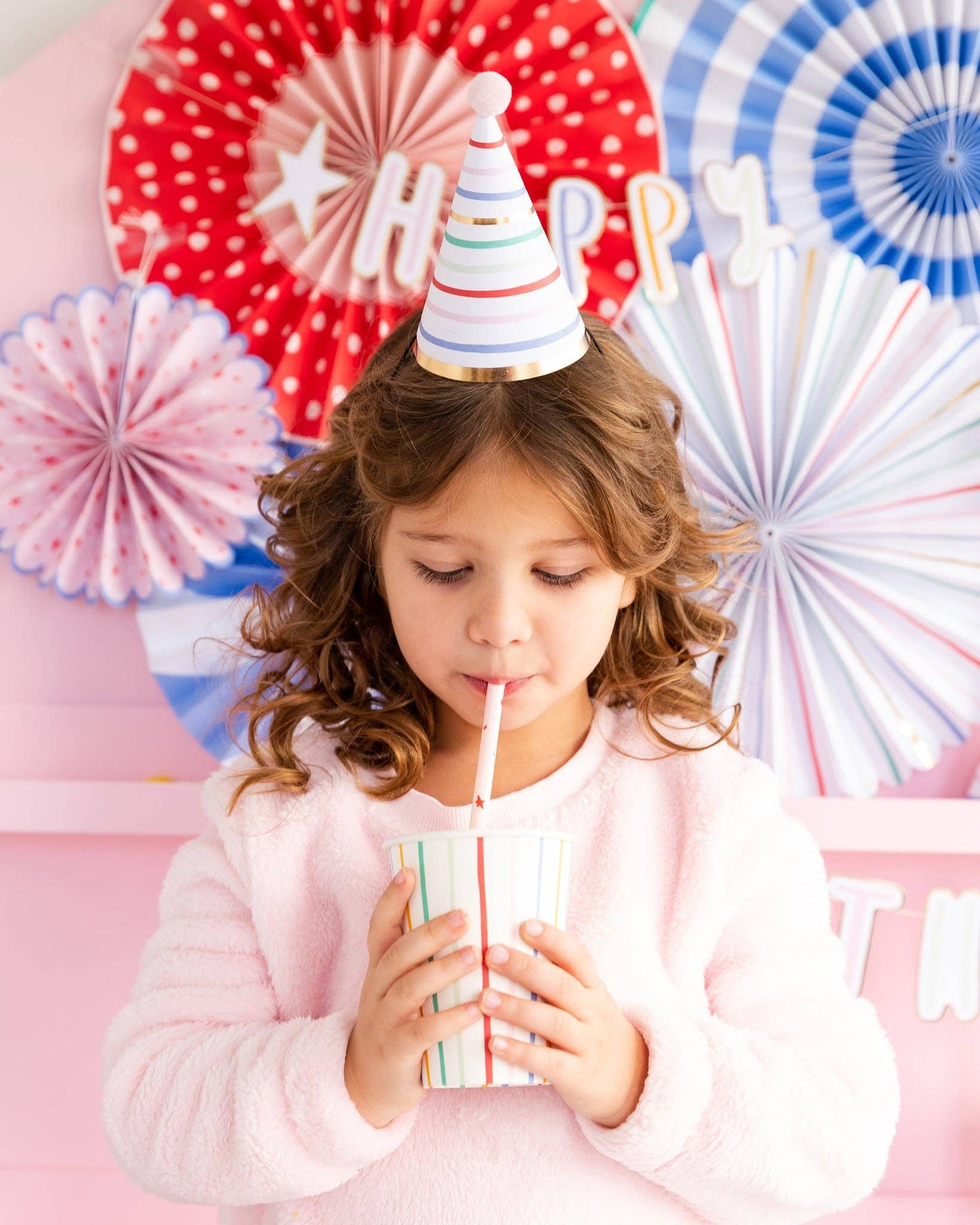 My Mind's Eye brand birthday party hat set of 8 in multicolor with gold foil is perfect for a toddler's birthday bash.