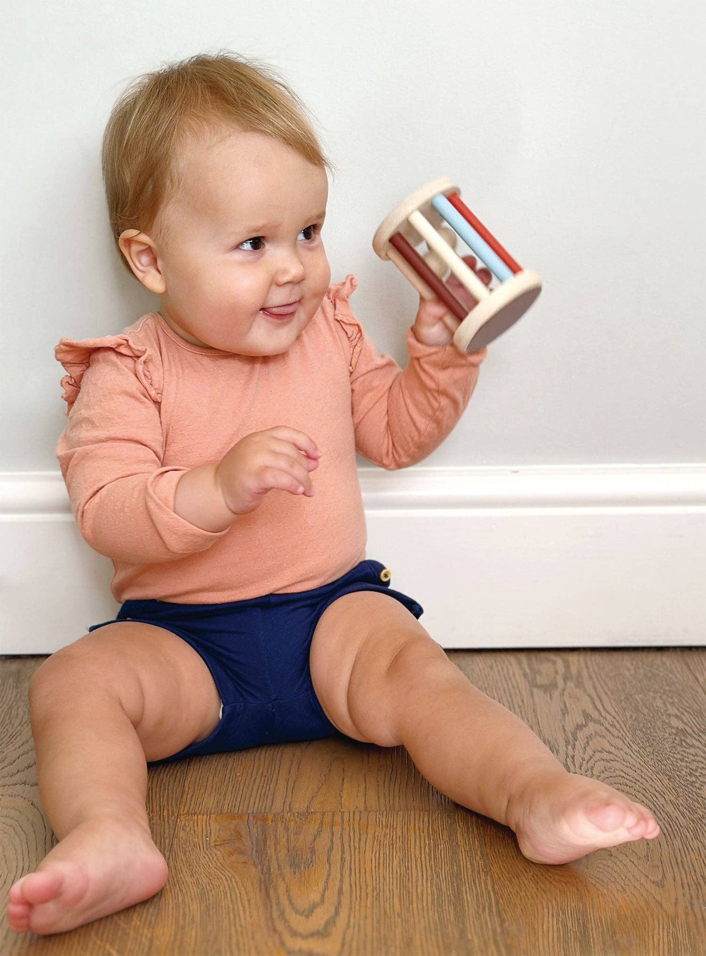 Mentari brand eco-friendly wooden rattle for baby to shake and roll.