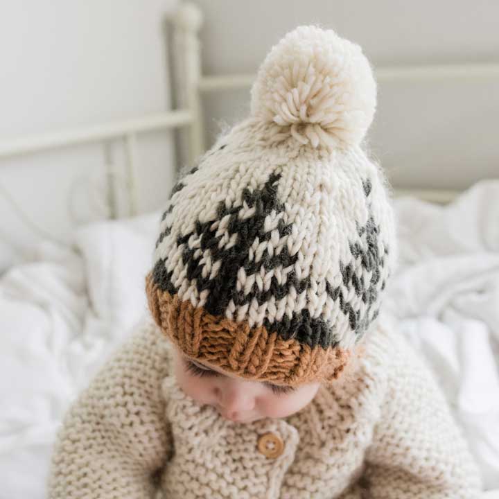 Beanie with handknit forest pattern and pom pom