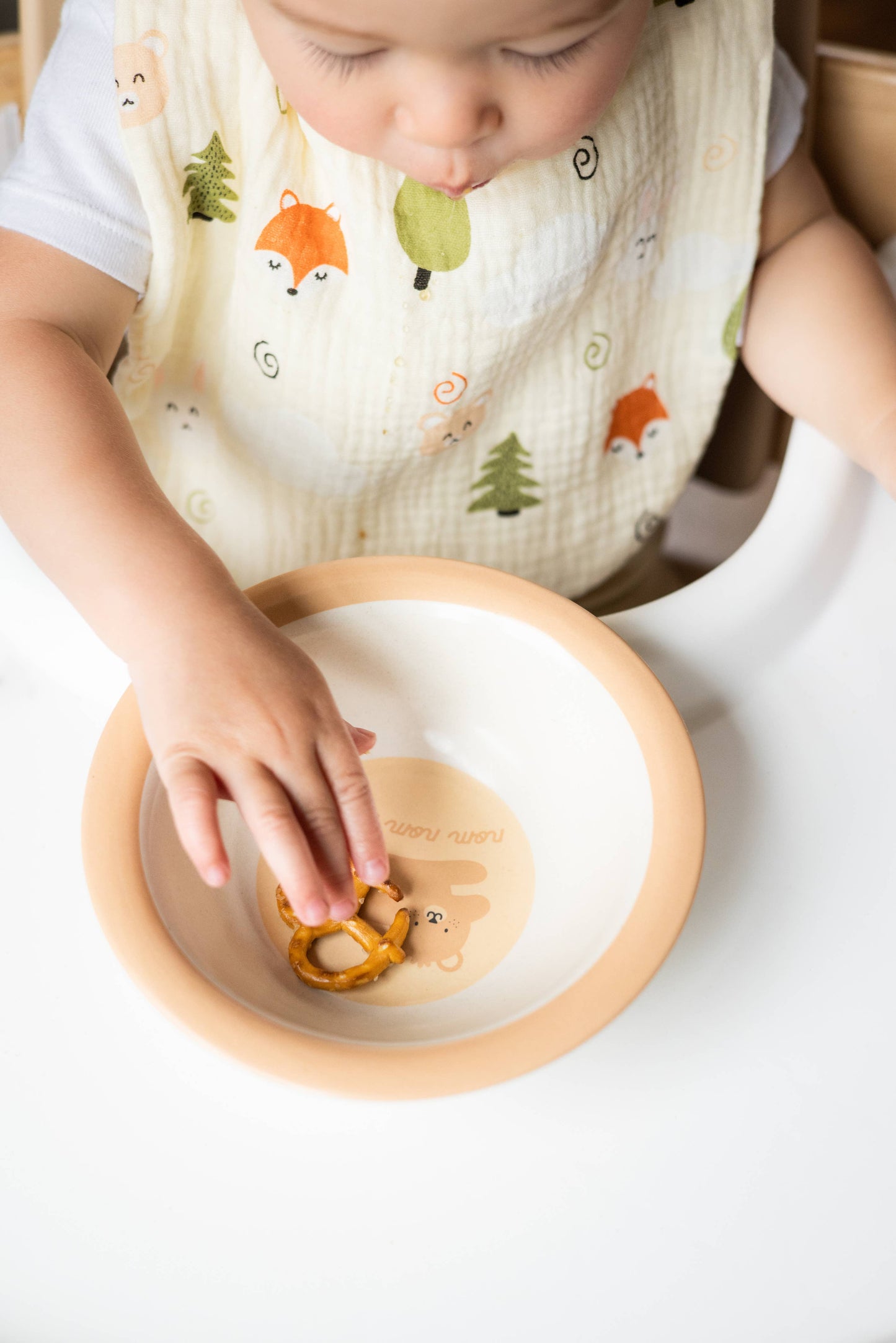 Set of 2 cotton muslin woodland print bibs for baby with fox, trees, bear design.