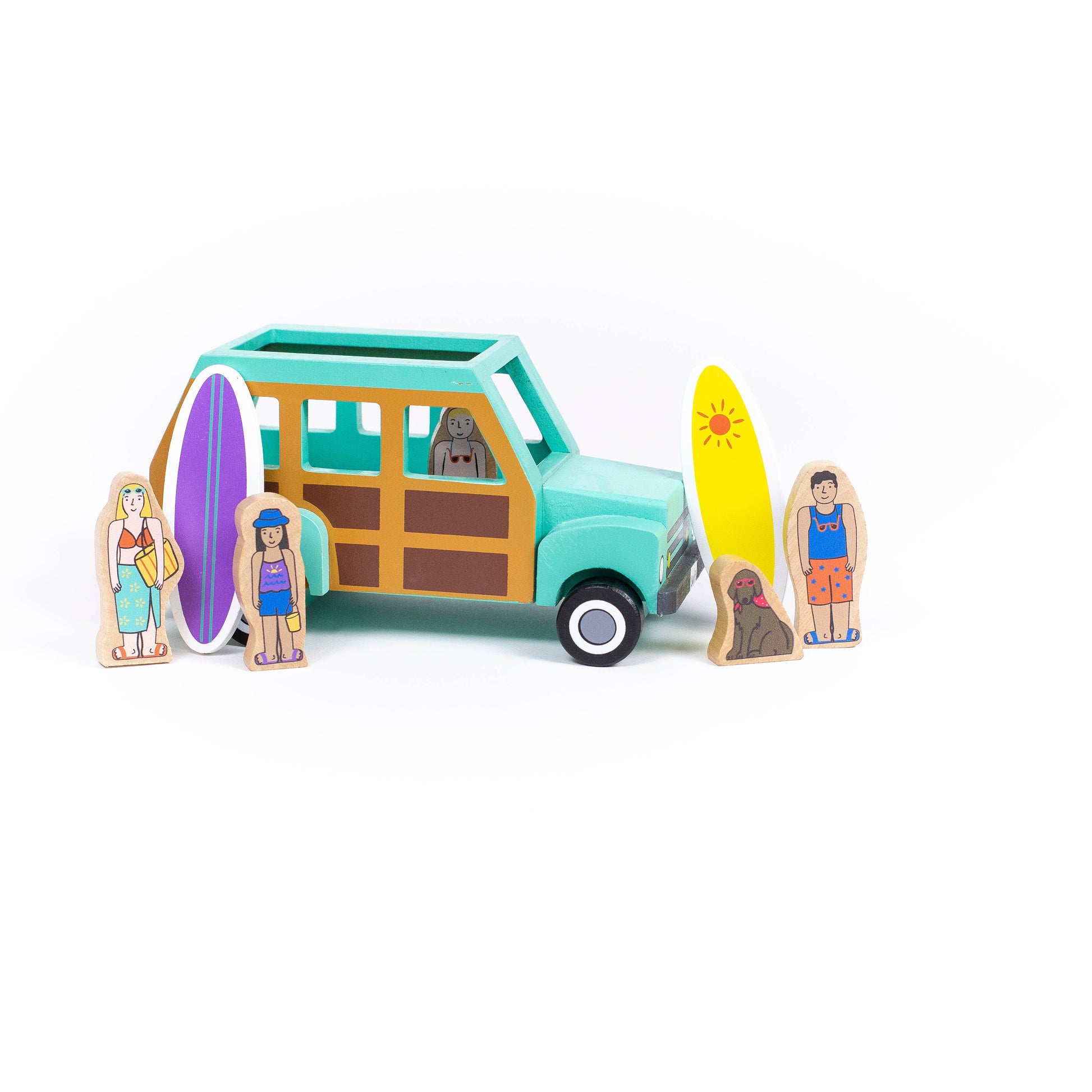 Wooden beach truck with magnetic people ready for surfing