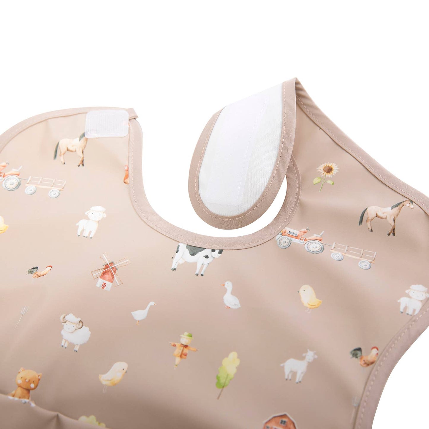 Oeko-tex certified waterproof smock bib in farm print velcros at neck