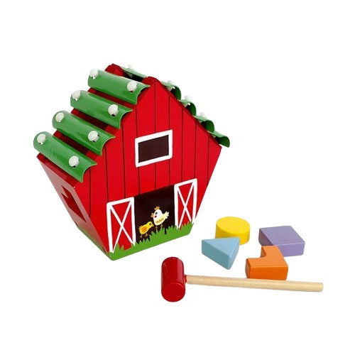 Little wooden red barn that is a xylophone and shape sorter in one toy.