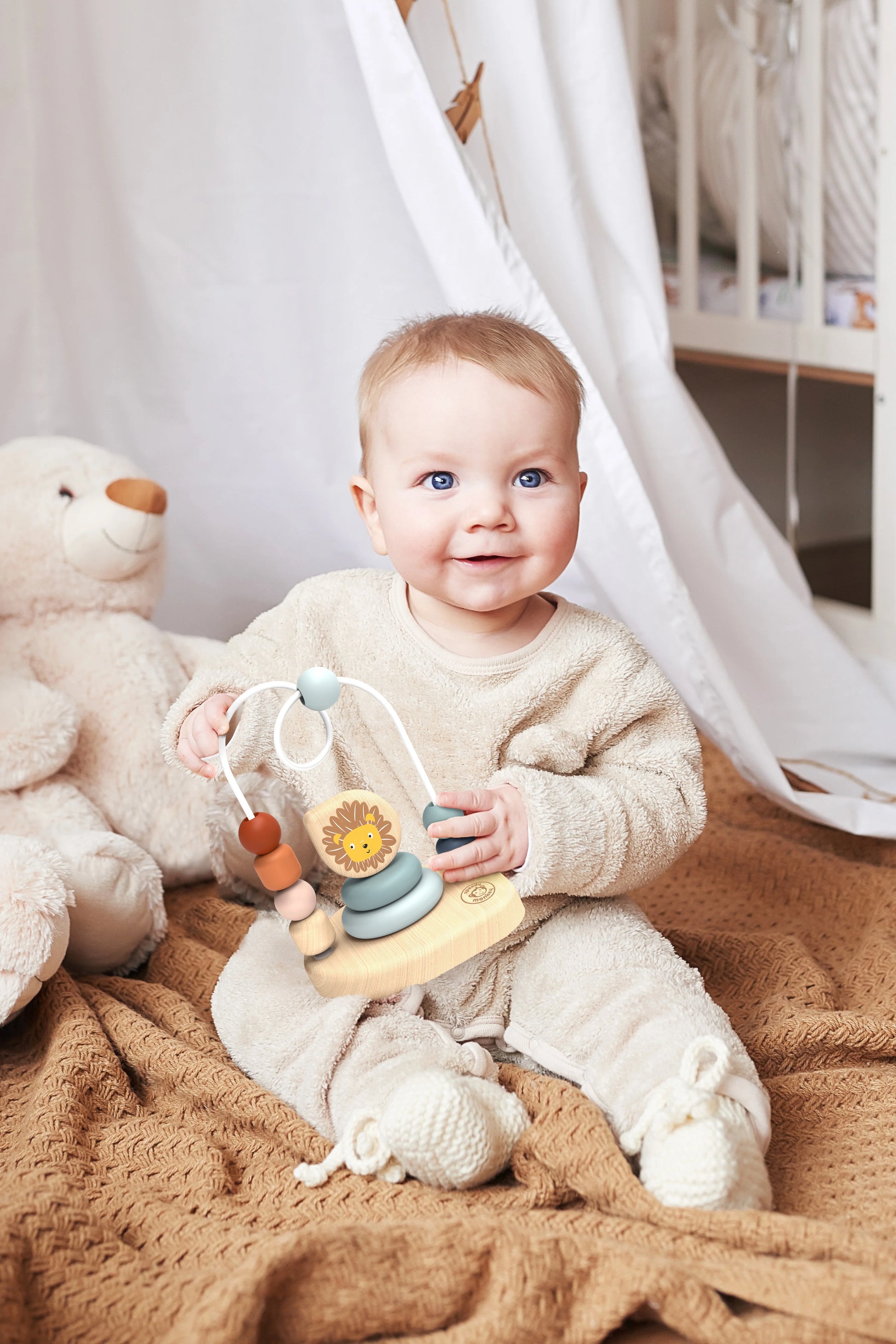 Baby holding Sustainable toy Bead maze and lion stacker that encourages fine motor skills