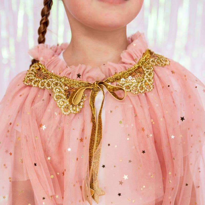 Close up of pink tulle, gold stars and gold glitter collar for dress up