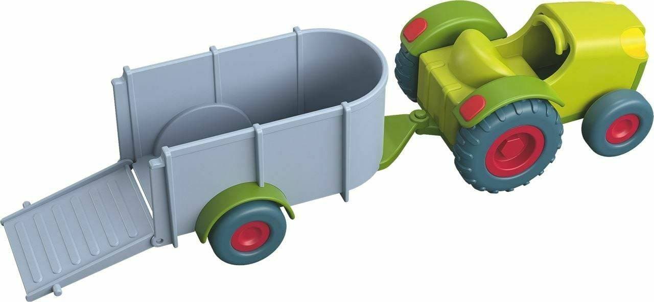 Haba brand green tractor and grey trailer for toddler boy gift.