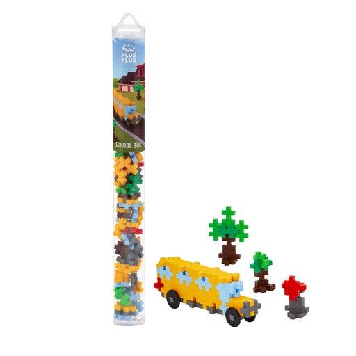 Plus Plus brand mini building block tube to construct a school bus.